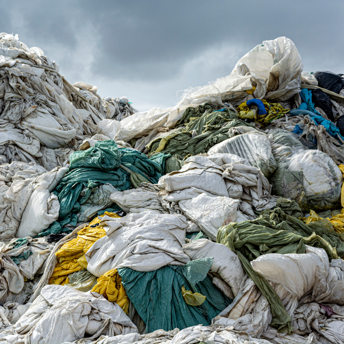 large pile of discarded textile waste | KENT | super natural basics