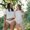 two women wearing white organic cotton t-shirt crop top made in California compostable